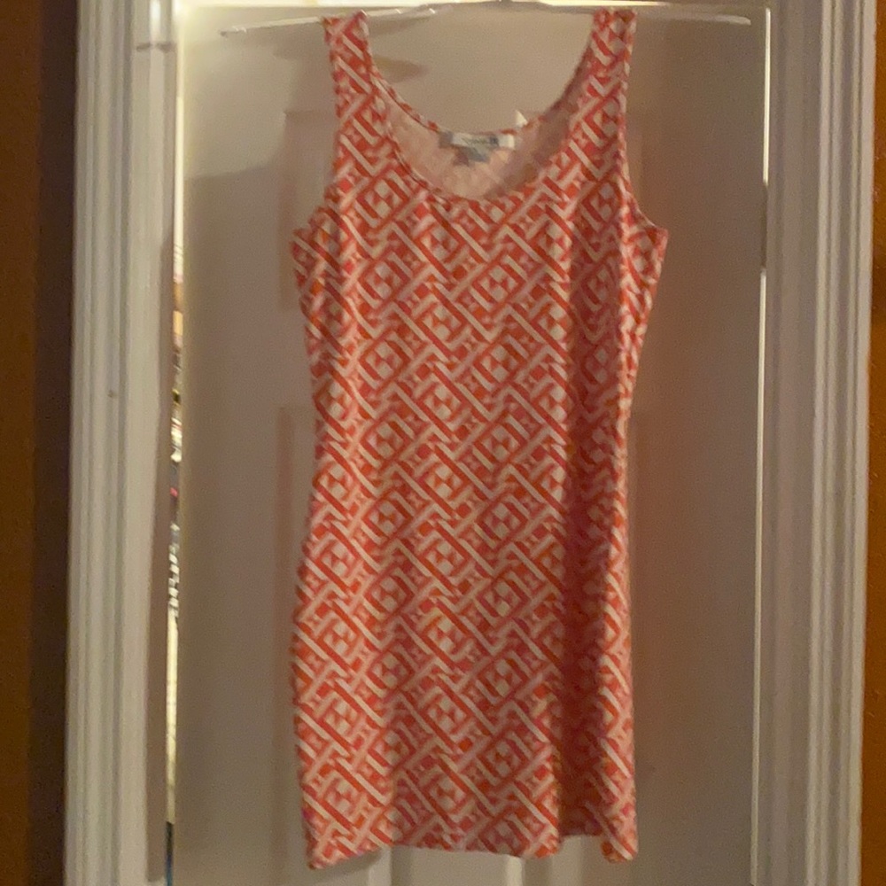 Orange and white patterned dress.